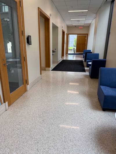 Interior corridor with doors mat lounge seating