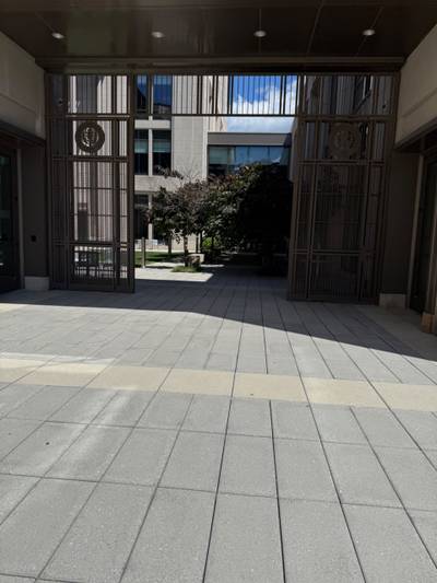 Decorative metal gates with open courtyard entrance