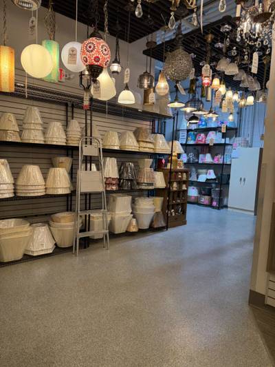 Lighting showroom with suspended fixtures and shelving