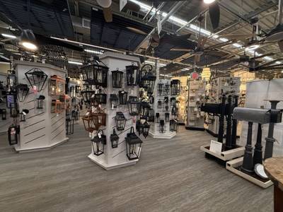 Lighting showroom with mounted lanterns and fans