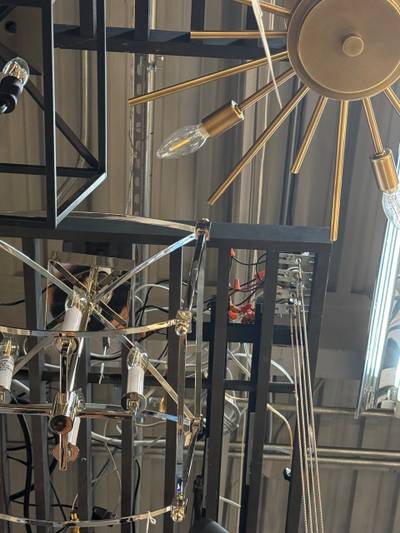 Densely hung chandeliers with exposed wiring