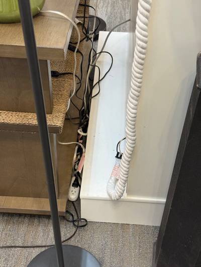 Power strip and cords on carpet