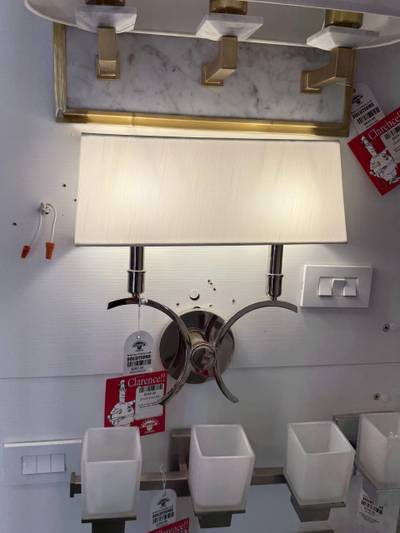 Wall sconce display fixtures with price tags