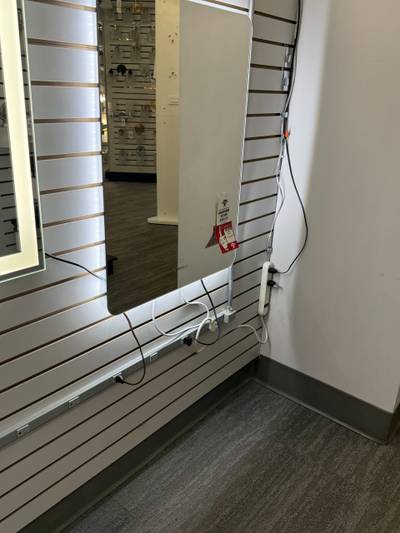Lighted mirrors on slatwall with power strips