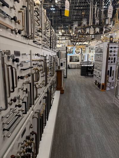 Showroom wall of door hardware with hanging