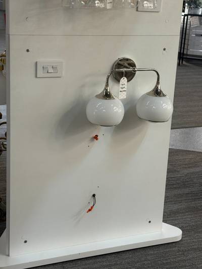 Wall sconce display with disconnected wiring leads