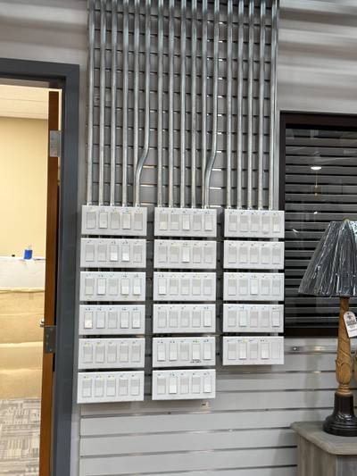 Wall display of light switches in conduit