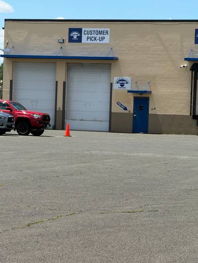 Customer pickup loading dock with traffic cone