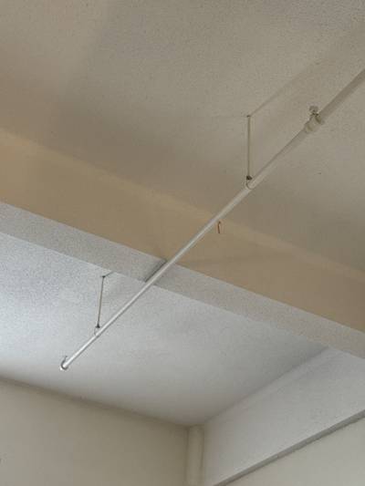 Sprinkler heads clear (≥18 in, no paint/damage)?