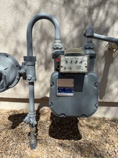 Exterior natural gas meter and piping on