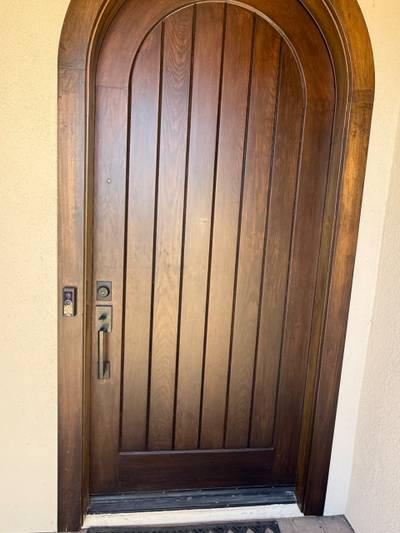 Arched wood front door with Ring doorbell