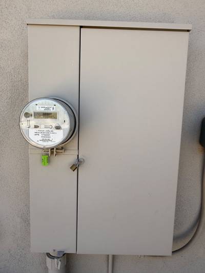 Locked exterior electrical meter and breaker cabinet