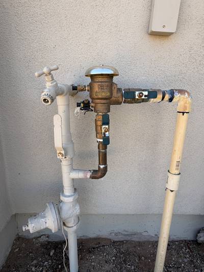 Backflow preventer assembly with hose bibb outdoors